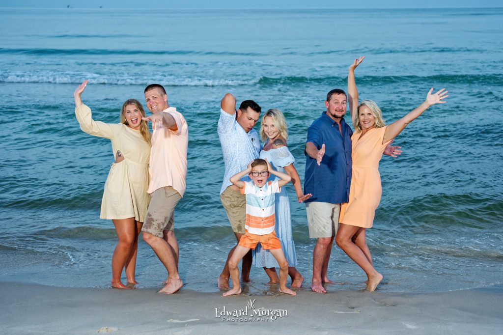 Orange Beach Photographers having fun with a family beach shoot in Alabama.