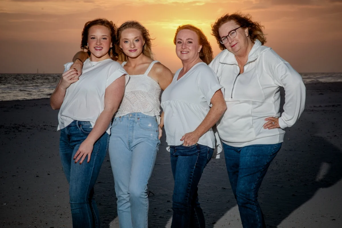 Orange beach photographer Sample Photos 15 Four girls during a photo session at sunset on the beach in Orange Beach, Alabama.