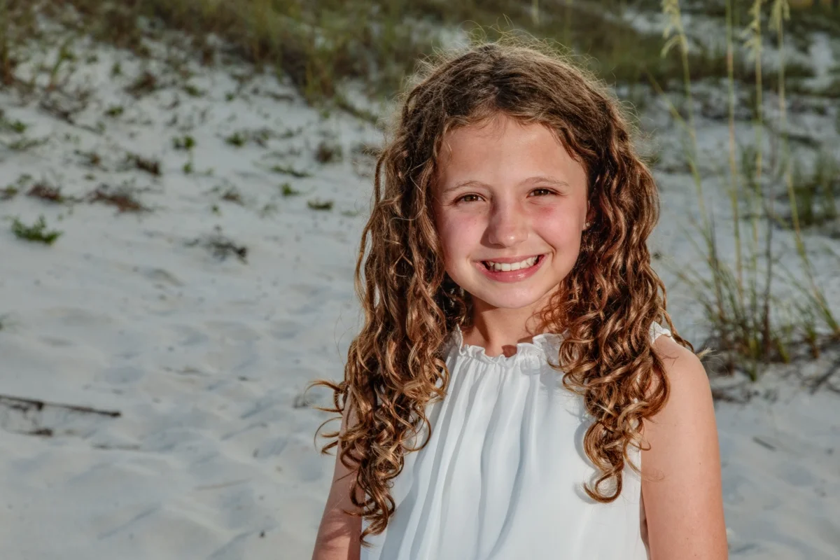 Orange beach photographer Sample Photos 10 Photo of a girl down by the beach in Orange Beach, Alabama during a family portrait session.