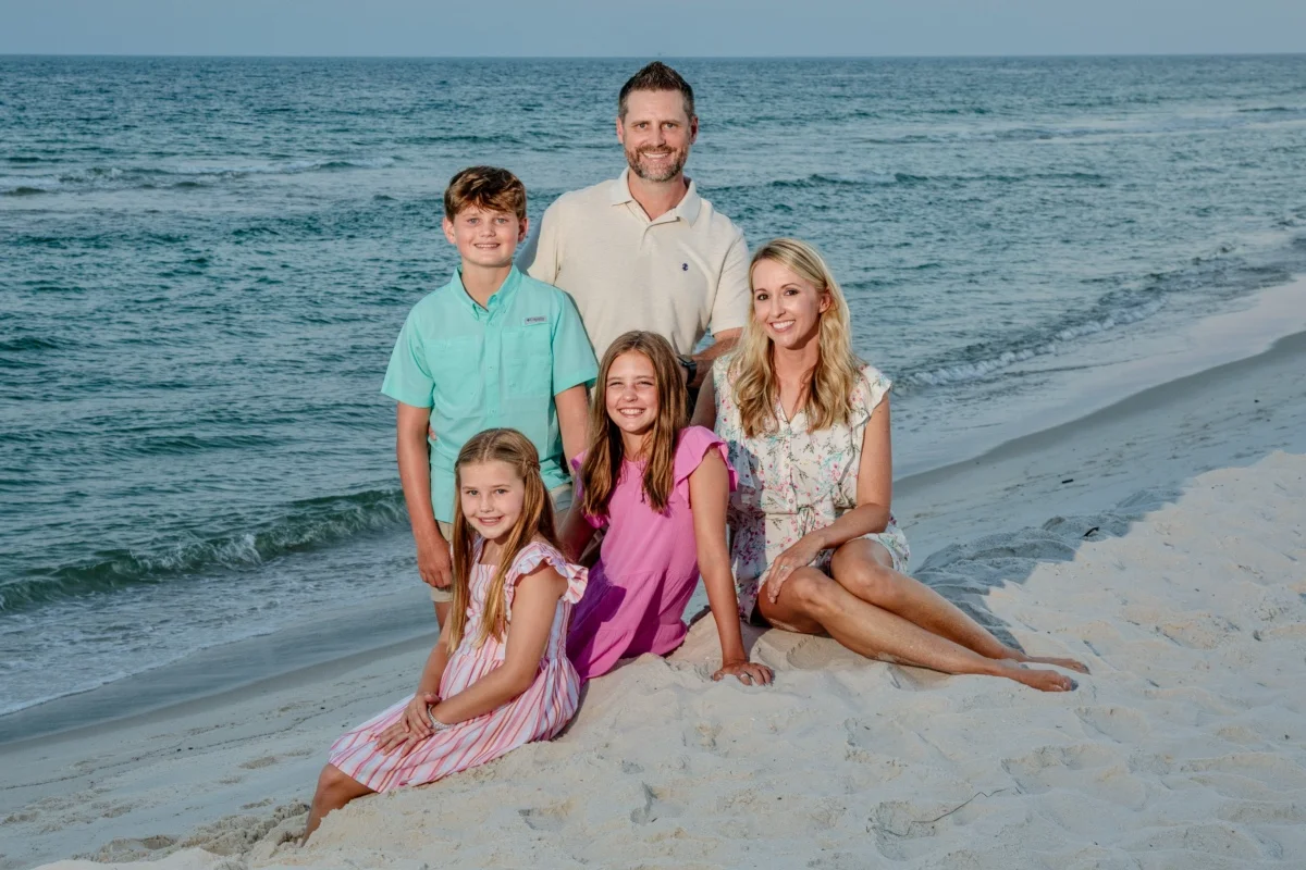 Orange Beach family photographer portraits family of five down by the water.