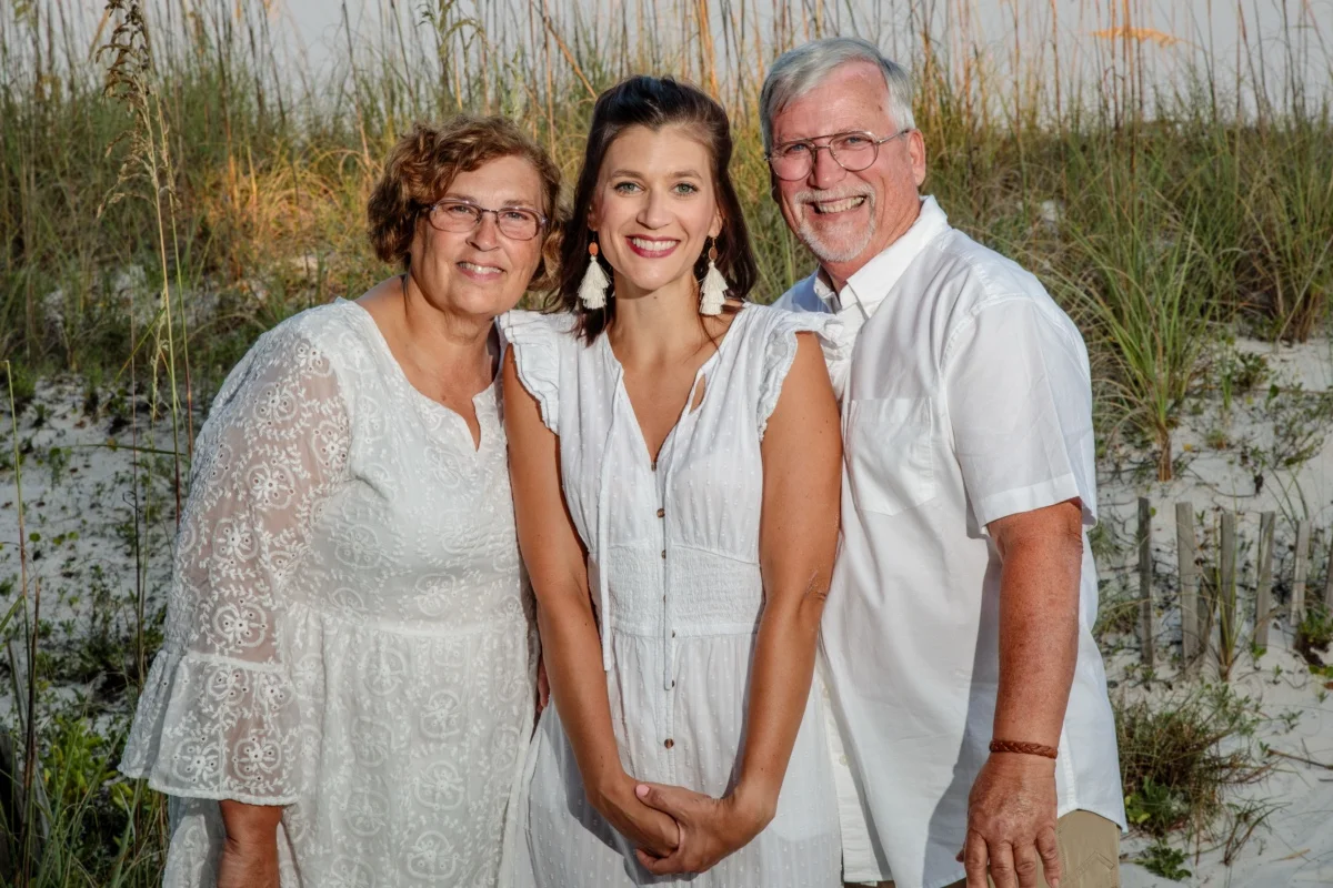 Three-person portrait shot on the beach by Orange Beach photographer.