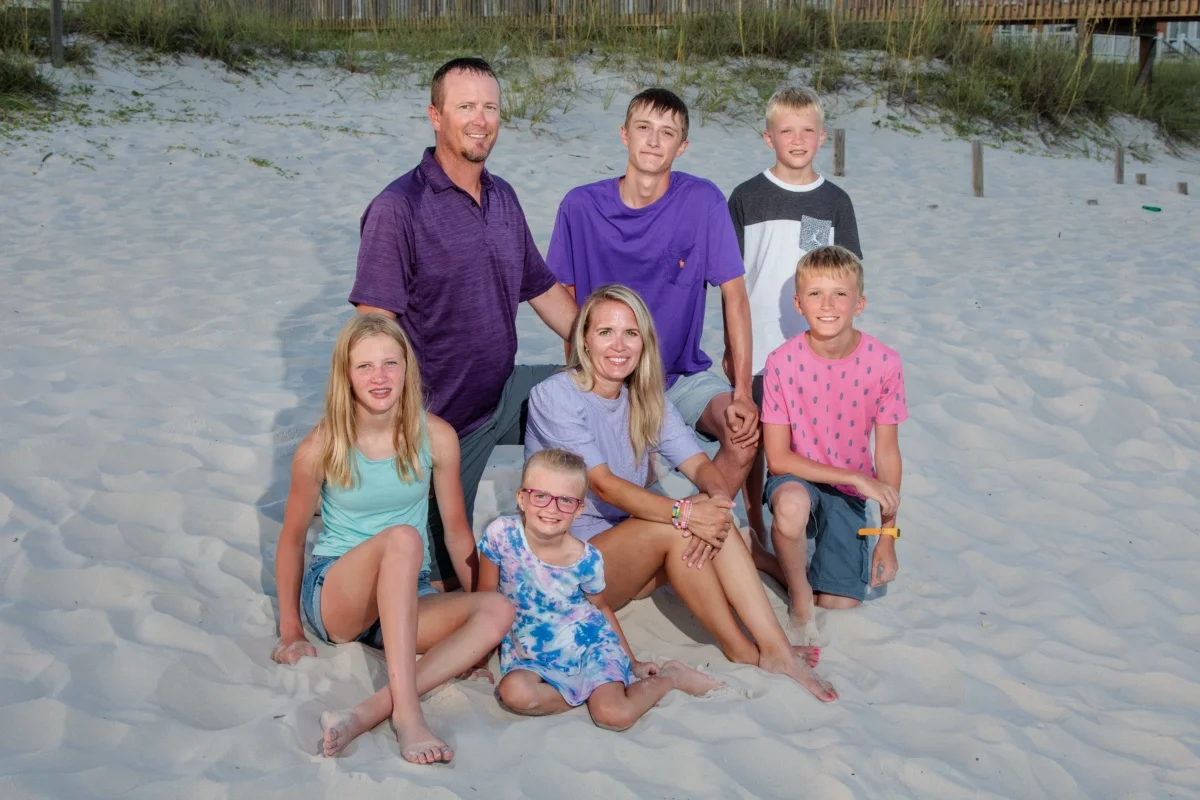 Orange beach photographer Sample Photos 7 Family sitting on the beach during an Orange Beach photo session in Alabama.