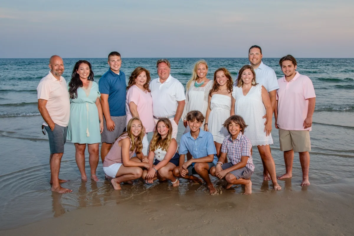 Orange beach photographer Sample Photos 3 Photos down by the water edge of a large family group during an Orange Beach family portrait session.