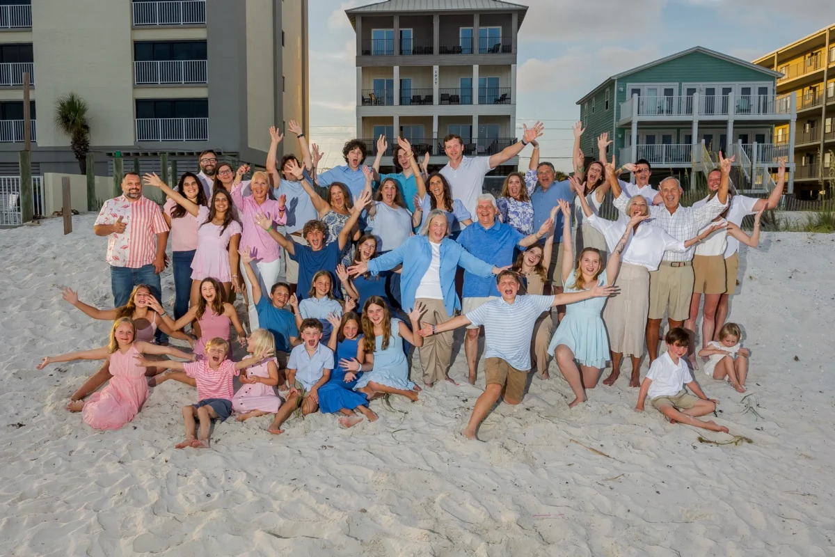 Orange beach photographer Are You Looking for an Orange Beach Photographer? 3 Orange Beach family photographer posing a large family group on the beach at sunset.
