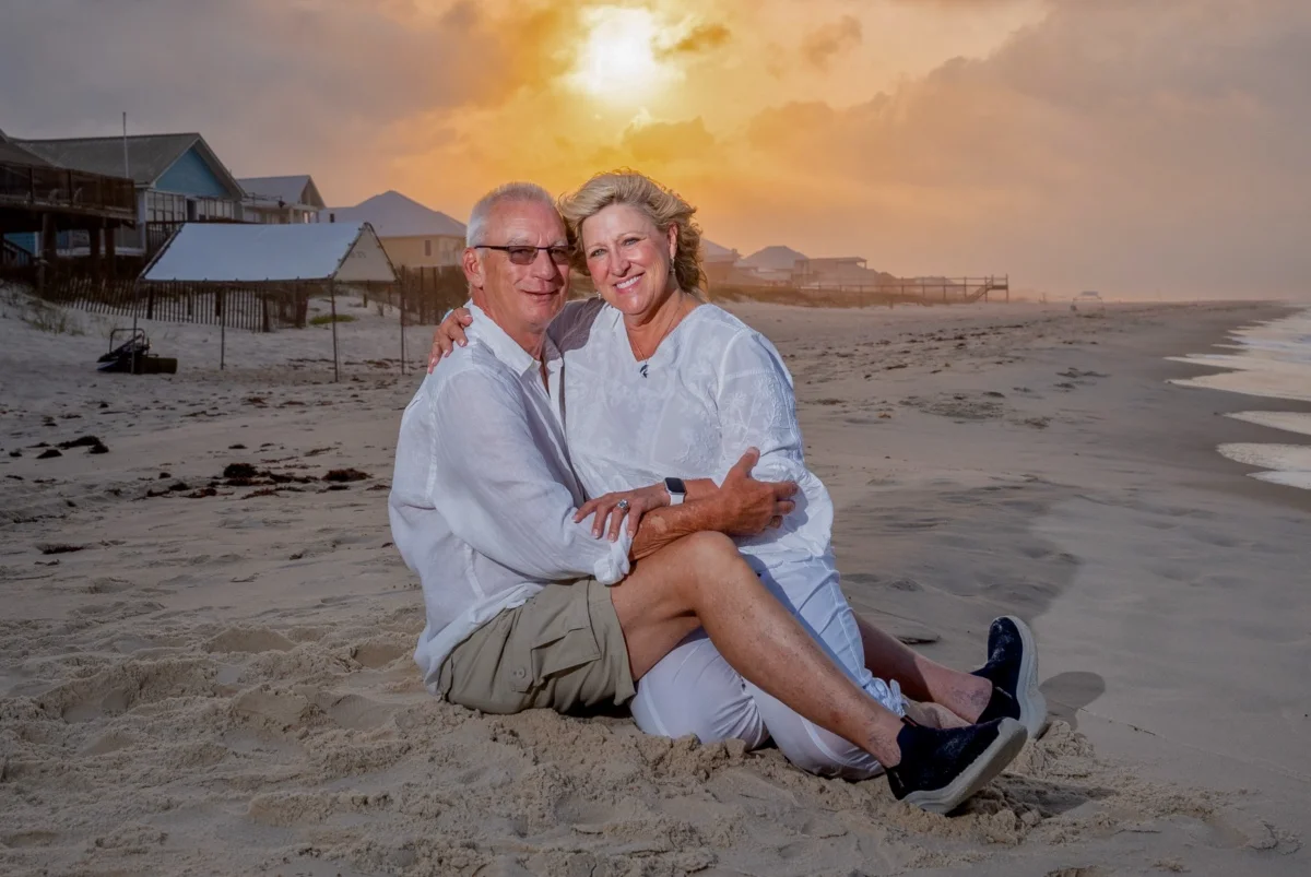 Orange beach photographer Sample Photos 12 Orange Beach family portrait of a couple sitting on the beach.
